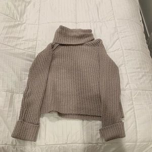 Stone color turtleneck sweater.